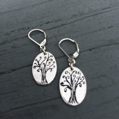 Fine Silver whimsical tree earrings,  hand etched and oxidized. These one of a kind earrings are finished securely on lever back findings. Each pair will be slightly different since each one are made completely by hand.
