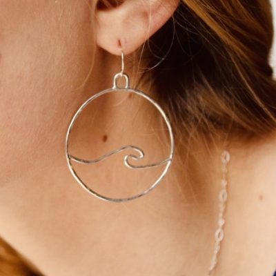 Catch the wave with our OG Medium Wave Earrings. These waves are made from sterling silver and unlike our hoop style, these hang from a French hook or leverback ear wire.