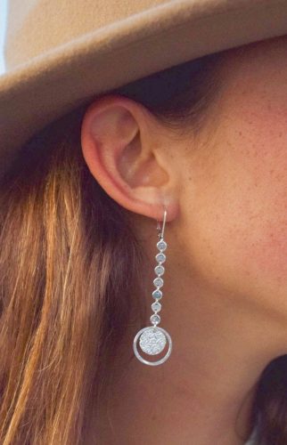 These Long Coin chain and starburst coin stand out on a sterling silver leverback earring.