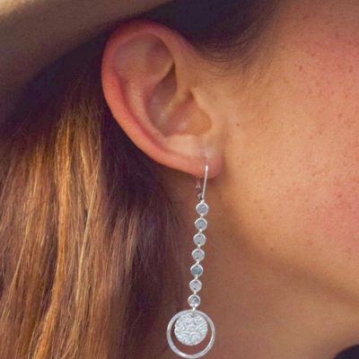 These Long Coin chain and starburst coin stand out on a sterling silver leverback earring.