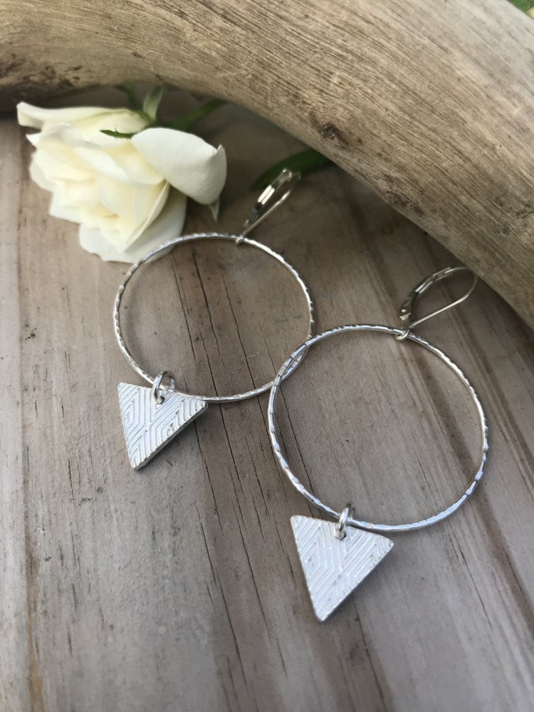 Tri~Dangle Sterling Silver Hoop Earrings are Hammered and finished on Sterling leverback earwires. A small triangle textured and made from fine silver will shift with your movements.